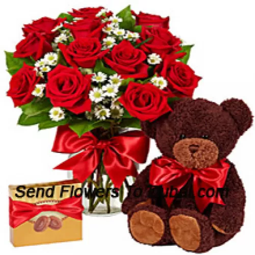 <b>Product Description</b><br><br>12 Red Roses With Some Ferns In A Glass Vase, A Cute 14 Inches Tall Teddy Bear And An Imported Box Of Chocolates<br><br><b>Delivery Information</b><br><br>* The design and packaging of the product can always vary and is subject to the availability of flowers and other products available at the time of delivery.<br><br>* The "Time selected is treated as a preference/request and is not a fixed time for delivery". We only guarantee delivery on a "Specified Date" and not within a specified "Time Frame".