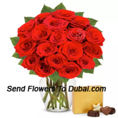 <b>Product Description</b><br><br>24 Red Roses With Some Ferns In A Glass Vase Accompanied With An Imported Box Of Chocolates<br><br><b>Delivery Information</b><br><br>* The design and packaging of the product can always vary and is subject to the availability of flowers and other products available at the time of delivery.<br><br>* The "Time selected is treated as a preference/request and is not a fixed time for delivery". We only guarantee delivery on a "Specified Date" and not within a specified "Time Frame".