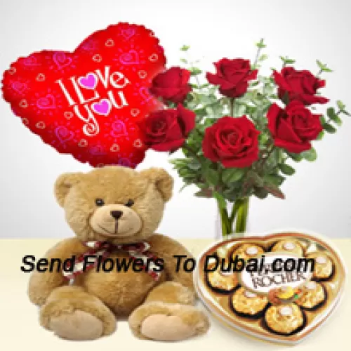 <b>Product Description</b><br><br>6 Red Roses With Some Ferns In A Glass Vase, A Cute 14 Inches Tall Brown Teddy Bear, 8 Pcs Heart Shaped Ferrero Rocher And An "I Love You" Balloon<br><br><b>Delivery Information</b><br><br>* The design and packaging of the product can always vary and is subject to the availability of flowers and other products available at the time of delivery.<br><br>* The "Time selected is treated as a preference/request and is not a fixed time for delivery". We only guarantee delivery on a "Specified Date" and not within a specified "Time Frame".