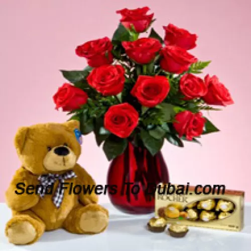 <b>Product Description</b><br><br>12 Red Roses With Some Ferns In A Glass Vase, A Cute 12 Inches Tall Brown Teddy Bear And A Box Of 16 Pcs Ferrero Rocher Chocolate<br><br><b>Delivery Information</b><br><br>* The design and packaging of the product can always vary and is subject to the availability of flowers and other products available at the time of delivery.<br><br>* The "Time selected is treated as a preference/request and is not a fixed time for delivery". We only guarantee delivery on a "Specified Date" and not within a specified "Time Frame".