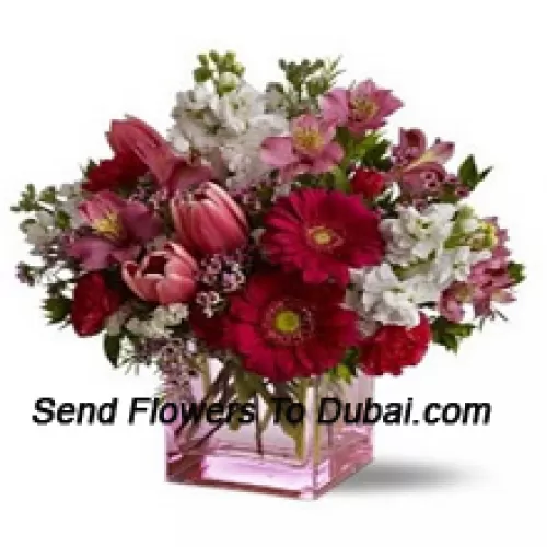 <b>Product Description</b><br><br>Red Roses, Red Tulips And Assorted Flowers With Seasonal Fillers Arranged Beautifully In A Glass Vase<br><br><b>Delivery Information</b><br><br>* The design and packaging of the product can always vary and is subject to the availability of flowers and other products available at the time of delivery.<br><br>* The "Time selected is treated as a preference/request and is not a fixed time for delivery". We only guarantee delivery on a "Specified Date" and not within a specified "Time Frame".