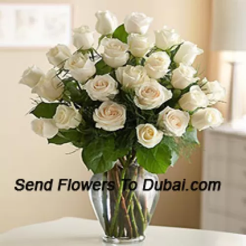 <b>Product Description</b><br><br>24 White Roses With Some Ferns In A Glass Vase<br><br><b>Delivery Information</b><br><br>* The design and packaging of the product can always vary and is subject to the availability of flowers and other products available at the time of delivery.<br><br>* The "Time selected is treated as a preference/request and is not a fixed time for delivery". We only guarantee delivery on a "Specified Date" and not within a specified "Time Frame".