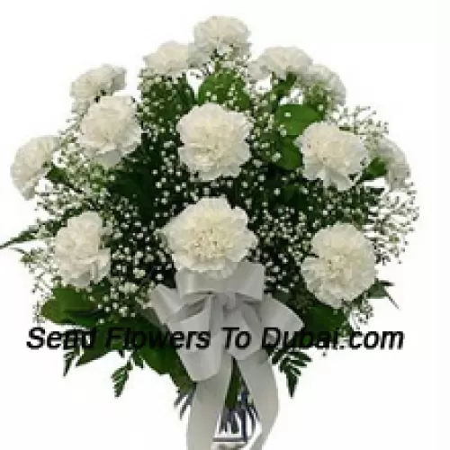 <b>Product Description</b><br><br>18 White Carnations With Seasonal Fillers In A Glass Vase<br><br><b>Delivery Information</b><br><br>* The design and packaging of the product can always vary and is subject to the availability of flowers and other products available at the time of delivery.<br><br>* The "Time selected is treated as a preference/request and is not a fixed time for delivery". We only guarantee delivery on a "Specified Date" and not within a specified "Time Frame".