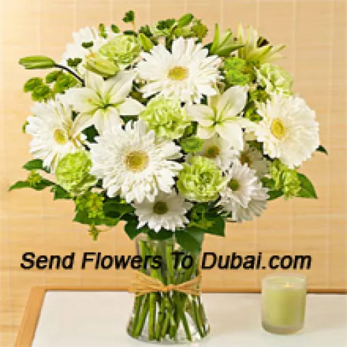 <b>Product Description</b><br><br>White Gerberas, White Alstroemeria And Other Assorted Seasonal Flowers Arranged Beautifully In A Glass Vase<br><br><b>Delivery Information</b><br><br>* The design and packaging of the product can always vary and is subject to the availability of flowers and other products available at the time of delivery.<br><br>* The "Time selected is treated as a preference/request and is not a fixed time for delivery". We only guarantee delivery on a "Specified Date" and not within a specified "Time Frame".