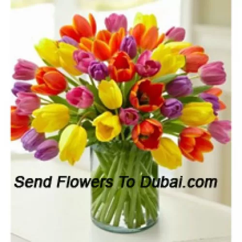 <b>Product Description</b><br><br>Mixed Colored Tulips In A Glass Vase - Please Note That In Case Of Non-Availability Of Certain Seasonal Flowers The Same Will Be Substituted With Other Flowers Of Same Value<br><br><b>Delivery Information</b><br><br>* The design and packaging of the product can always vary and is subject to the availability of flowers and other products available at the time of delivery.<br><br>* The "Time selected is treated as a preference/request and is not a fixed time for delivery". We only guarantee delivery on a "Specified Date" and not within a specified "Time Frame".