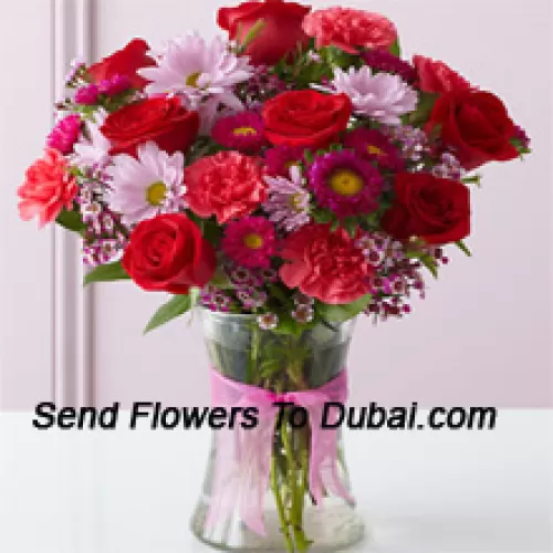 <b>Product Description</b><br><br>Red Roses, Red Carnations And Other Assorted Flowers Arranged Beautifully In A Glass Vase<br><br><b>Delivery Information</b><br><br>* The design and packaging of the product can always vary and is subject to the availability of flowers and other products available at the time of delivery.<br><br>* The "Time selected is treated as a preference/request and is not a fixed time for delivery". We only guarantee delivery on a "Specified Date" and not within a specified "Time Frame".