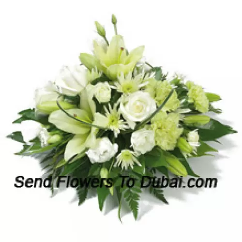 <b>Product Description</b><br><br>A Beautiful Arrangement Of White Roses, White Carnations, White Lilies And Assorted White Flowers With Seasonal Fillers<br><br><b>Delivery Information</b><br><br>* The design and packaging of the product can always vary and is subject to the availability of flowers and other products available at the time of delivery.<br><br>* The "Time selected is treated as a preference/request and is not a fixed time for delivery". We only guarantee delivery on a "Specified Date" and not within a specified "Time Frame".