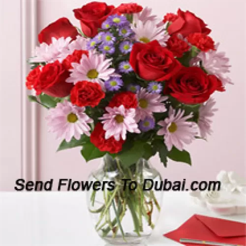 <b>Product Description</b><br><br>Red Roses, Red Carnations And Pink Gerberas With Seasonal Fillers In A Glass Vase -- 24 Stems And Fillers<br><br><b>Delivery Information</b><br><br>* The design and packaging of the product can always vary and is subject to the availability of flowers and other products available at the time of delivery.<br><br>* The "Time selected is treated as a preference/request and is not a fixed time for delivery". We only guarantee delivery on a "Specified Date" and not within a specified "Time Frame".