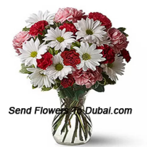 <b>Product Description</b><br><br>Red Carnations, Pink Carnations And White Gerberas With Seasonal Fillers In A Glass Vase -- 24 Stems And Fillers<br><br><b>Delivery Information</b><br><br>* The design and packaging of the product can always vary and is subject to the availability of flowers and other products available at the time of delivery.<br><br>* The "Time selected is treated as a preference/request and is not a fixed time for delivery". We only guarantee delivery on a "Specified Date" and not within a specified "Time Frame".