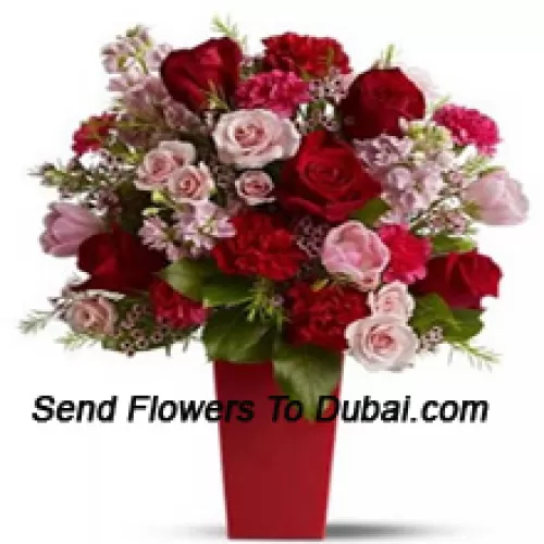 <b>Product Description</b><br><br>Red Roses, Red Carnations And Pink Roses With Seasonal Fillers In A Glass Vase -- 24 Stems And Fillers<br><br><b>Delivery Information</b><br><br>* The design and packaging of the product can always vary and is subject to the availability of flowers and other products available at the time of delivery.<br><br>* The "Time selected is treated as a preference/request and is not a fixed time for delivery". We only guarantee delivery on a "Specified Date" and not within a specified "Time Frame".