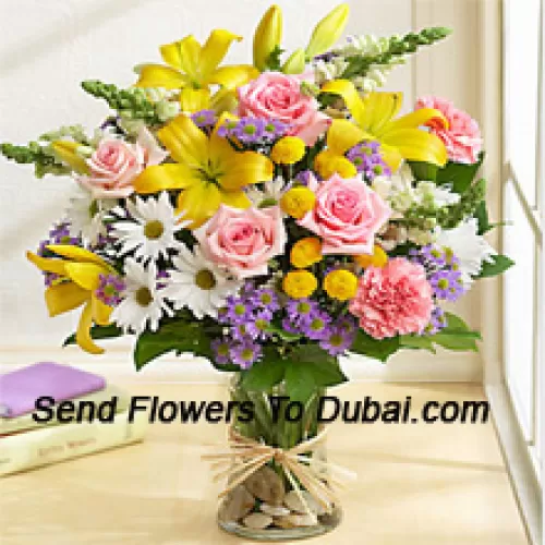 <b>Product Description</b><br><br>Pink Roses, Pink Carnations, White Gerberas And Yellow Lilies With Seasonal Fillers In A Glass Vase<br><br><b>Delivery Information</b><br><br>* The design and packaging of the product can always vary and is subject to the availability of flowers and other products available at the time of delivery.<br><br>* The "Time selected is treated as a preference/request and is not a fixed time for delivery". We only guarantee delivery on a "Specified Date" and not within a specified "Time Frame".
