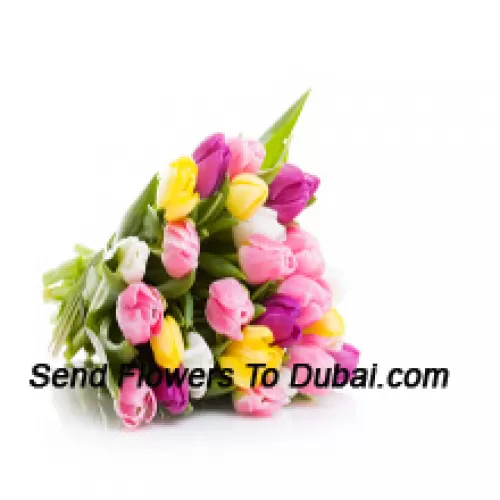 Un magnifique bouquet de tulipes colorées mélangées avec des remplissages saisonniers - Veuillez noter que en cas de non disponibilité de certaines fleurs saisonnières, celles-ci seront remplacées par d'autres fleurs de même valeur