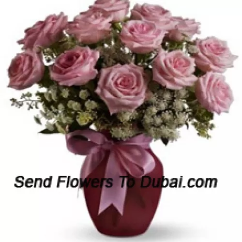 <b>Product Description</b><br><br>12 Pink Roses With Assorted White Fillers In A Glass Vase<br><br><b>Delivery Information</b><br><br>* The design and packaging of the product can always vary and is subject to the availability of flowers and other products available at the time of delivery.<br><br>* The "Time selected is treated as a preference/request and is not a fixed time for delivery". We only guarantee delivery on a "Specified Date" and not within a specified "Time Frame".