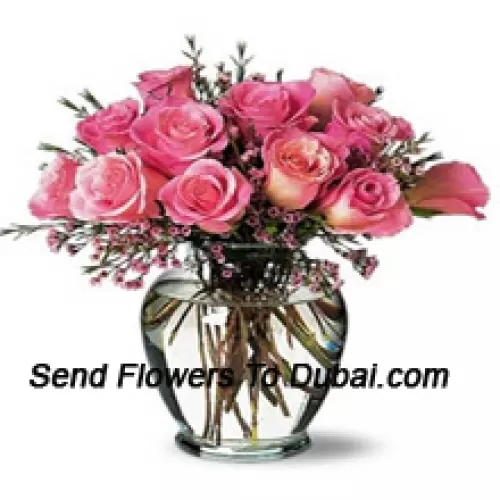 <b>Product Description</b><br><br>12 Pink Roses With Some Ferns In A Vase<br><br><b>Delivery Information</b><br><br>* The design and packaging of the product can always vary and is subject to the availability of flowers and other products available at the time of delivery.<br><br>* The "Time selected is treated as a preference/request and is not a fixed time for delivery". We only guarantee delivery on a "Specified Date" and not within a specified "Time Frame".