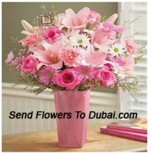 <b>Product Description</b><br><br>Pink Roses, Pink Carnations, Pink Gerberas, White Gerberas And Pink Lilies With Seasonal Fillers In A Glass Vase<br><br><b>Delivery Information</b><br><br>* The design and packaging of the product can always vary and is subject to the availability of flowers and other products available at the time of delivery.<br><br>* The "Time selected is treated as a preference/request and is not a fixed time for delivery". We only guarantee delivery on a "Specified Date" and not within a specified "Time Frame".