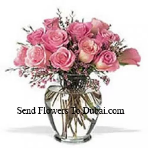 <b>Product Description</b><br><br>Bunch Of 12 Pink Roses With Some Ferns In A Vase<br><br><b>Delivery Information</b><br><br>* The design and packaging of the product can always vary and is subject to the availability of flowers and other products available at the time of delivery.<br><br>* The "Time selected is treated as a preference/request and is not a fixed time for delivery". We only guarantee delivery on a "Specified Date" and not within a specified "Time Frame".