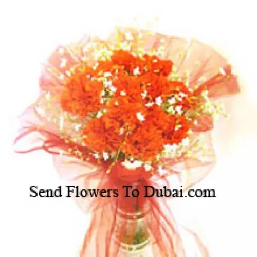 <b>Product Description</b><br><br>12 Orange Carnations With Some Ferns In A Vase<br><br><b>Delivery Information</b><br><br>* The design and packaging of the product can always vary and is subject to the availability of flowers and other products available at the time of delivery.<br><br>* The "Time selected is treated as a preference/request and is not a fixed time for delivery". We only guarantee delivery on a "Specified Date" and not within a specified "Time Frame".