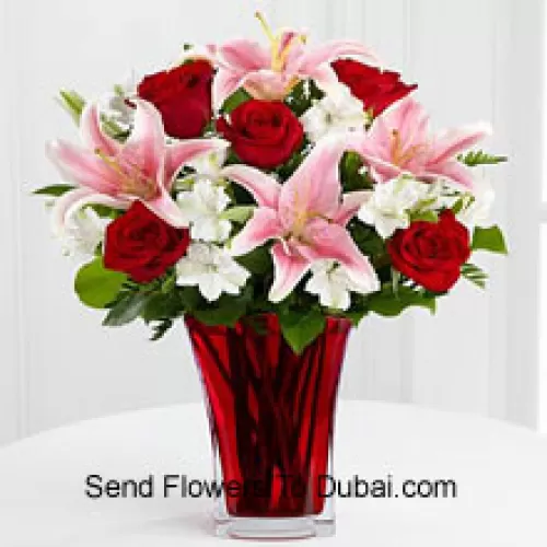 <b>Product Description</b><br><br>6 Red Roses And 5 Pink Lilies With Seasonal Fillers In A Beautiful Glass Vase<br><br><b>Delivery Information</b><br><br>* The design and packaging of the product can always vary and is subject to the availability of flowers and other products available at the time of delivery.<br><br>* The "Time selected is treated as a preference/request and is not a fixed time for delivery". We only guarantee delivery on a "Specified Date" and not within a specified "Time Frame".