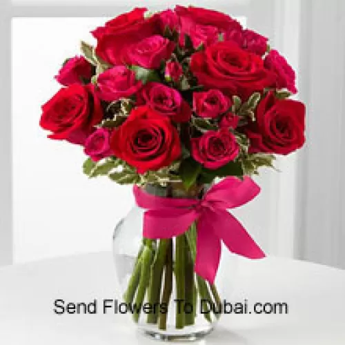 <b>Product Description</b><br><br>18 Red Roses With Seasonal Fillers In A Glass Vase Decorated With A Pink Bow<br><br><b>Delivery Information</b><br><br>* The design and packaging of the product can always vary and is subject to the availability of flowers and other products available at the time of delivery.<br><br>* The "Time selected is treated as a preference/request and is not a fixed time for delivery". We only guarantee delivery on a "Specified Date" and not within a specified "Time Frame".