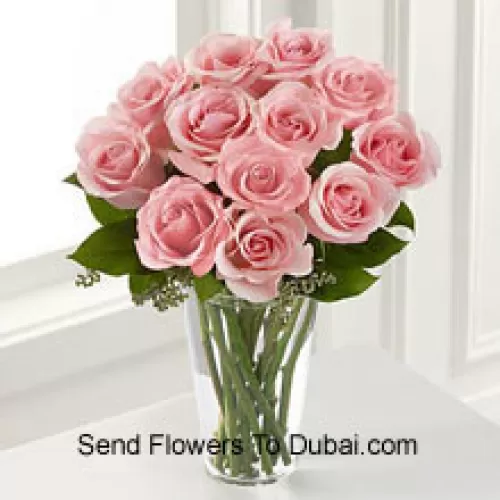 <b>Product Description</b><br><br>12 Pink Roses With Some Ferns In A Vase<br><br><b>Delivery Information</b><br><br>* The design and packaging of the product can always vary and is subject to the availability of flowers and other products available at the time of delivery.<br><br>* The "Time selected is treated as a preference/request and is not a fixed time for delivery". We only guarantee delivery on a "Specified Date" and not within a specified "Time Frame".