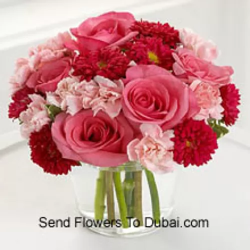 <b>Product Description</b><br><br>6 Pink Roses, 10 Red Colored Daisies And 10 Pink Colored Carnations In A Glass Vase<br><br><b>Delivery Information</b><br><br>* The design and packaging of the product can always vary and is subject to the availability of flowers and other products available at the time of delivery.<br><br>* The "Time selected is treated as a preference/request and is not a fixed time for delivery". We only guarantee delivery on a "Specified Date" and not within a specified "Time Frame".