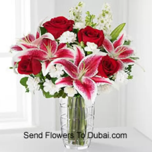 <b>Product Description</b><br><br>Red Roses, Pink Lilies With Assorted White Flowers In A Glass Vase<br><br><b>Delivery Information</b><br><br>* The design and packaging of the product can always vary and is subject to the availability of flowers and other products available at the time of delivery.<br><br>* The "Time selected is treated as a preference/request and is not a fixed time for delivery". We only guarantee delivery on a "Specified Date" and not within a specified "Time Frame".