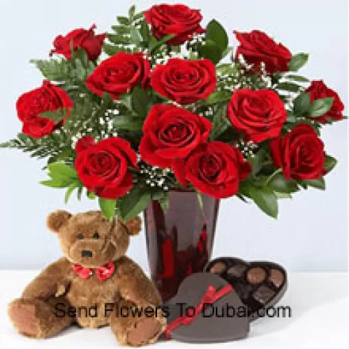<b>Product Description</b><br><br>12 Red Roses With Some Ferns In A Vase, Cute Brown 10 Inches Teddy Bear And A Heart Shaped Chocolate Box.<br><br><b>Delivery Information</b><br><br>* The design and packaging of the product can always vary and is subject to the availability of flowers and other products available at the time of delivery.<br><br>* The "Time selected is treated as a preference/request and is not a fixed time for delivery". We only guarantee delivery on a "Specified Date" and not within a specified "Time Frame".