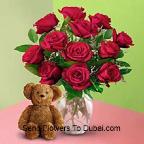 <b>Product Description</b><br><br>12 Red Roses With Some Ferns In A Vase And A Cute Brown 8 Inches Teddy Bear<br><br><b>Delivery Information</b><br><br>* The design and packaging of the product can always vary and is subject to the availability of flowers and other products available at the time of delivery.<br><br>* The "Time selected is treated as a preference/request and is not a fixed time for delivery". We only guarantee delivery on a "Specified Date" and not within a specified "Time Frame".