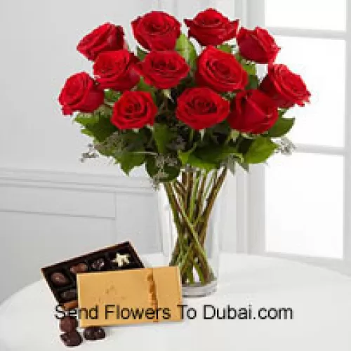 <b>Product Description</b><br><br>12 Red Roses With Some Ferns In A Vase And A Box Of Godiva Chocolates (We reserve the right to substitute the Godiva chocolates with chocolates of equal value in case of non-availability of the same. Limited Stock)<br><br><b>Delivery Information</b><br><br>* The design and packaging of the product can always vary and is subject to the availability of flowers and other products available at the time of delivery.<br><br>* The "Time selected is treated as a preference/request and is not a fixed time for delivery". We only guarantee delivery on a "Specified Date" and not within a specified "Time Frame".